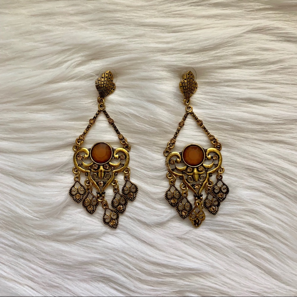 Golden dangle earring.